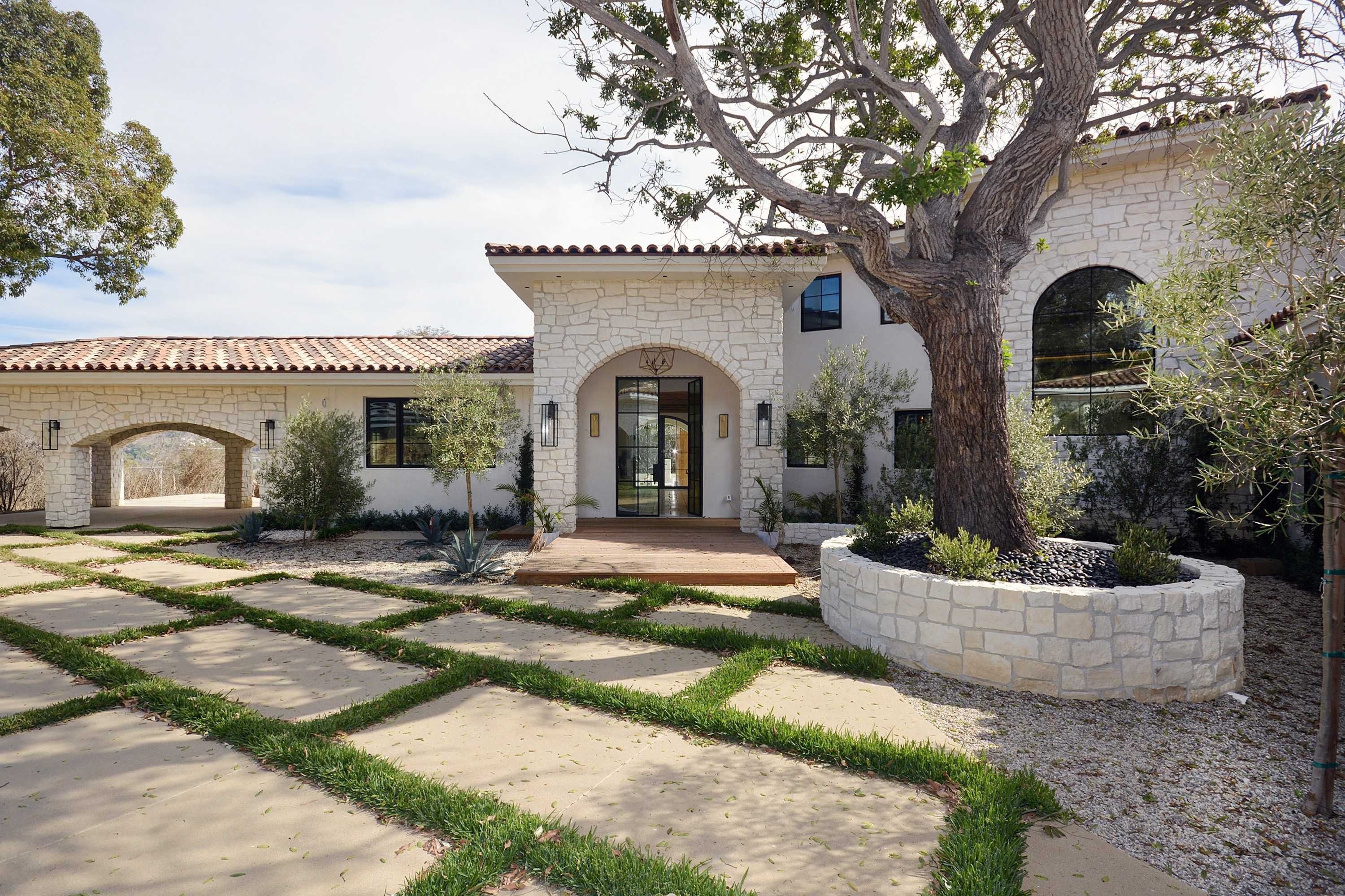 Stone and stucco custom home built by Zuma Construction